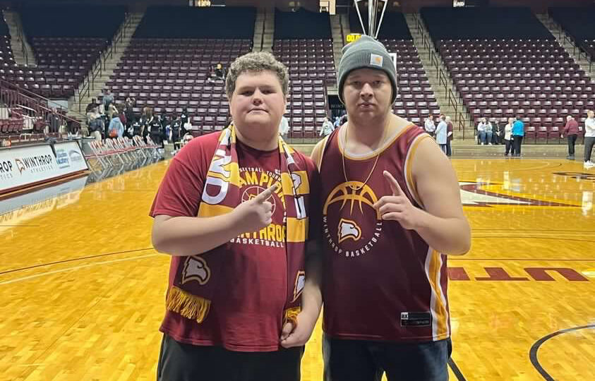 Best friends Alex and Josh show their love of Winthrop sports at a home basketball game